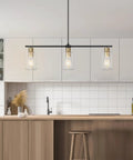 Three Light Linear Farmhouse Kitchen Island Lighting In Black And Gold Finish With Glass Shades above modern kitchen island.