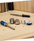 Beefy Heavy Duty Stainless Steel Pulley Block Set For Boats Kayaks And Yachts, shown with tools on a wooden bench
