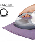 Pro Grade Heavy Duty Steam Hose For Steam Iron Replacement, showing a hand using a steam iron with the hose and fabric visible.