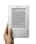 Sleek White Second Gen Ereader Features A Sharp Six Inch Screen And Free 3G Wireless To Pull Down Books Anywhere, held in hand.