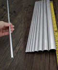 Sixteen Inch Aluminum Round Tube With Five Sixteenth Inch Outer Diameter And One Millimeter Wall Thickness Hollow Seamless Tubing Made From 6063 Aluminum Six Piece Set displayed with tape measure