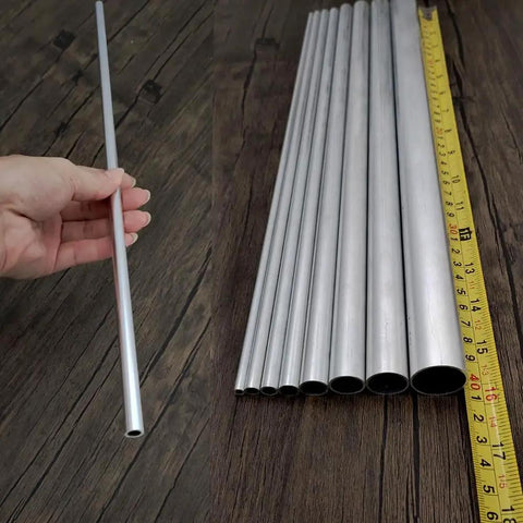Sixteen Inch Aluminum Round Tube With Five Sixteenth Inch Outer Diameter And One Millimeter Wall Thickness Hollow Seamless Tubing Made From 6063 Aluminum Six Piece Set displayed with tape measure