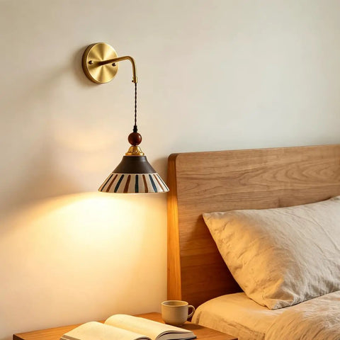 DWEIHDV Ceramic Wall Sconce Vintage Gold Wall Light Fixture above a wooden bed, showcasing a hand-painted striped ceramic shade.