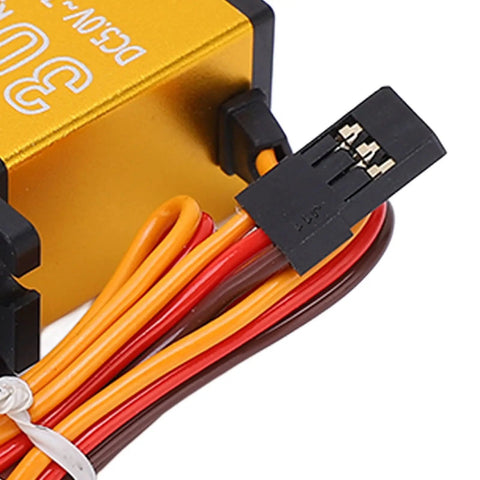 Knockout 30 Kg Digital RC Servo With Heavy Duty Metal Gears And Precision 25T Horn CNC Aluminum Case Double Ball Bearings showing connectors and wires.