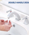 Hands under running water from widespread 8 inch bathroom faucet with 2 handles, 3-hole lavatory sink mixer in chrome.