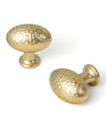 Top Shelf Champagne Bronze Cabinet Knobs With A Hammered Oval Dome And Soft Metallic Luster Gives Your Space A Real Deal Modern Twist Perfect For Updating Kitchen Drawers And Furniture Arrives In A Quick Six Pack Bundle, displaying two hammered oval dome knobs.