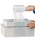 Person using Snag This Gotta Have 6 Roll Stretch Wrap Film Set With Premium 80 Gauge Cling Plastic on stacked boxes.