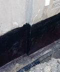 Kickass Rubberized Waterproofing Sealant For Foundations And Flat Low Slope Roofs Concrete Wood Metal Black Five Gallon Multi Purpose Coating applied on foundation wall.