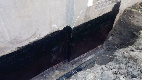 Kickass Rubberized Waterproofing Sealant For Foundations And Flat Low Slope Roofs Concrete Wood Metal Black Five Gallon Multi Purpose Coating applied on foundation wall.