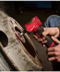 Person using Top Tier Quarter Inch Cordless Right Angle Die Grinder With Brushless Motor and Snappy Trigger on a metal wheel.