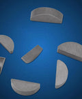80Pcs Woodruff Key Set In Carbon Steel For Flywheels Pulleys And Crankshafts Half Moon Keys scattered on blue background