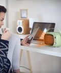 Fast Heating Desk Space Heater With Adjustable Thermostat, 800W/500W Ceramic Heating Fan for indoor use, compact green design.