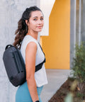 Woman wearing Lightweight 6L Crossbody Sling Bag For Travel And Everyday Carry, Anti Theft Pocket System, outdoors