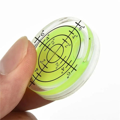 Close-up of Two Pack Mini Bubble Level Set With 20 To 30 Degree Accuracy for precise spirit level readouts in hand.