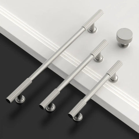 Top Shelf Brushed Satin Nickel Kitchen Cabinet Knobs 6 Pack Slick Drawer Handles, three sizes and round knob on white surface.