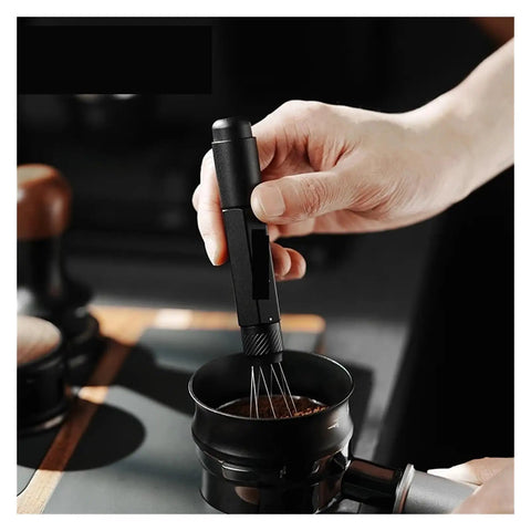 Professional Espresso Coffee Ground Distributor With 16 Stainless Steel Needles Magnetic Telescopic Stirrer Leveler used on coffee grounds.