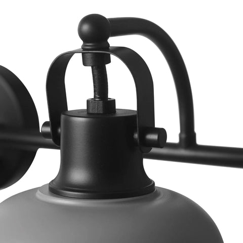 Close-up of a light fixture from Gladstone 5 Piece All In One Bathroom Set With Matte Black Finish Includes A 3 Light Vanity Fixture