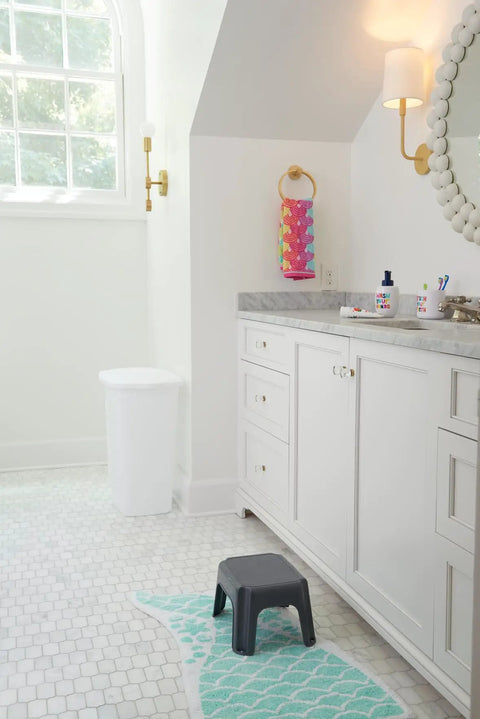 Sturdy 7 Inch One Step Stool In Gray With Non Slip Top And Four Rugged Feet Holds Up To 200 Pounds next to bathroom sink