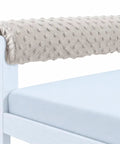 Easy-Install Toddler Bed Rail Bumpers, Safe Memory Foam Guardrail with grey dimpled fabric on bed frame.