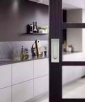 4 Pack 4.72 Inch Recessed Pocket Door Handles Brushed Nickel Stainless Steel Flush Pulls installed on a sliding barn door in modern kitchen
