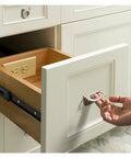 Close-up of Bottom Mounted Metal Buffer Drawer Slides Two Pack Concealed Cabinet Tracks in kitchen cabinet with plug.