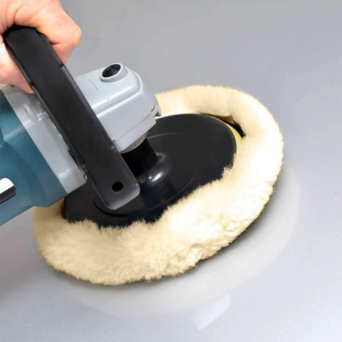 Using Eight Inch 100 Percent Natural Wool Buffing Pads Set Pro Grade with hook-and-loop backing on car surface