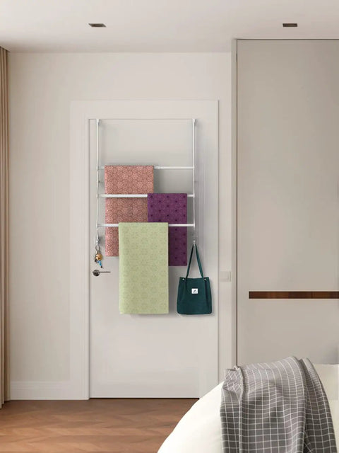 Adjustable Over The Door Towel Rack With Hooks For Bathroom Telescoping Crossbar Adjusts From 12.9 To 23.5 Inches Triple Bar Hanging Organizer Easy Access Towel Holder Space Saving White Finish in use with towels and bag hanging in bathroom.