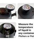 Close-up of a thermometer measuring the temperature of liquid in a stainless steel container, labeled for use in pitchers or pots.