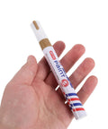 Hand holding gold oil-based marker, Six Pack Gold Oil Based Paint Markers For Tombstone Restoration And Memorials, Waterproof And Weatherproof.