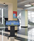 Built Tough 43 Inch Touchscreen Digital Signage Stand With Smooth Motorized Lift And Tilt Crisp Full HD 1080P Workhorse Mobile Kiosk For Retail Professionals in a school lobby.