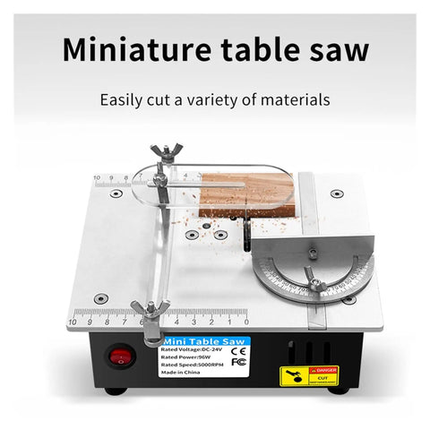 Compact Mini Table Saw With 24V Motor And 63mm Blade For Quick Woodwork Projects Featuring Easy Forty Five Degree Angled Cuts Plus Built In Safety Guard, showing cutting action with wood.