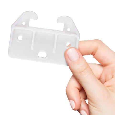 Slick White Plastic Drawer Track Guide Kit Packing 10 Pieces With Badass Durability And Hella Smooth Gliding Motion Top Shelf Center Mount Replacement For Any Furniture Fix, detail of one track piece in hand.
