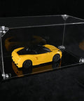 No Sweat Setup Acrylic Display Case Triangle Connector Seamless Assembly Clear Display Box with a yellow toy car inside.