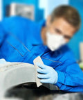 Person using 18 Piece Wet And Dry Sandpaper Set Pro Grade 3000 5000 7000 Grit for Auto Body and DIY Finishing on car surface