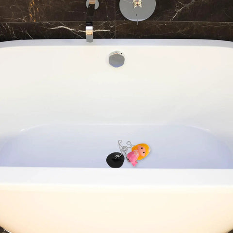 Mermaid Bathtub Stopper Plug Rubber Drain Seal with Chain floating in a modern white bathtub with pink toy