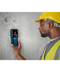 Electrician using Pro Grade Wall Scanner For Electricians And Contractors All In One Multi Function Stud Finder on concrete wall