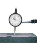 Rugged Pro Grade Dial Indicator Gauge with 0.01mm accuracy measuring a surface, aluminum alloy, shockproof, rust resistant