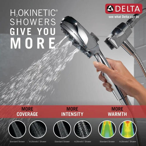 Close-up of a person holding the Sure Dock Chrome Hand Shower With MagnaTite Docking and 7 Spray Settings with H2Okinetic technology in use.