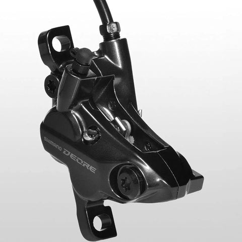 Close-up of Deore M6120 Hydraulic Disc Brake Front Post Mount Black Resin Pads Included Caliper, side view