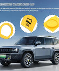 Yellow windshield washer fluid cap for car with close-up on durable material and design, car parked in the background.