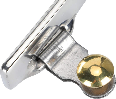 Close-up of stainless steel cowboy spur with copper cap buckle, part of the Stainless Steel Cowboy Spurs With Spur Straps And Copper Cap Buckle set.