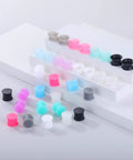 Silicone Ear Plugs Gauge Stretching Kit for Ear Piercings and Lobe Stretchers, 32 Pieces in Mixed Colors Displayed on Shelves