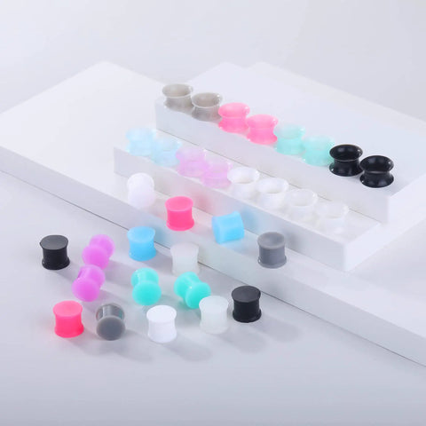 Silicone Ear Plugs Gauge Stretching Kit for Ear Piercings and Lobe Stretchers, 32 Pieces in Mixed Colors Displayed on Shelves