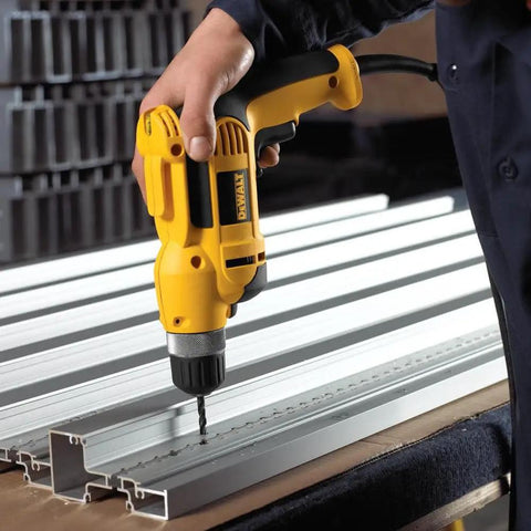 Person using Corded Drill Beast With 8 Amp Motor, 0-2,500 RPM, 3/8 Inch Keyless Chuck, Pistol Grip, Soft Grip Comfort on metal beams.