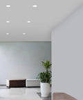 Slick LED Recessed Retrofit Light Delivers A No Sweat Install And Straight Threads Into Standard 4 5 Or 6 Inch Housing Can With A Snappy Telescoping Arm And Five Adjustable CCT Levels For Crisp Ceiling Glow Pack Of Four installed in a modern ceiling.