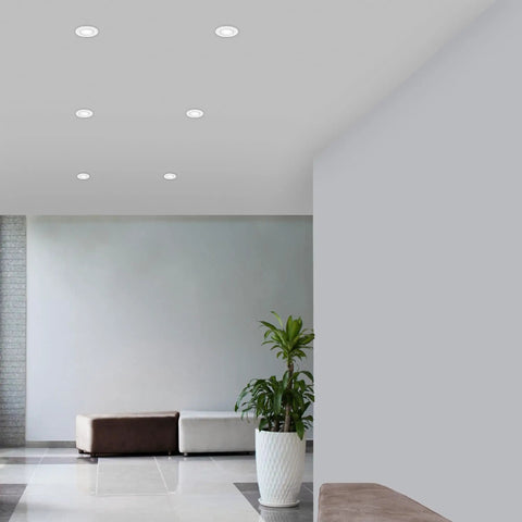 Slick LED Recessed Retrofit Light Delivers A No Sweat Install And Straight Threads Into Standard 4 5 Or 6 Inch Housing Can With A Snappy Telescoping Arm And Five Adjustable CCT Levels For Crisp Ceiling Glow Pack Of Four installed in a modern ceiling.