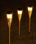 Solar Powered Bamboo Tiki Torch Lights 4 Pack For Outdoors Garden Yard And Fence Line Warm White Glow Waterproof And Rustproof Auto On At Dusk No Wiring Needed Eco Friendly Easy Setup Lanterns For Cozy Nights