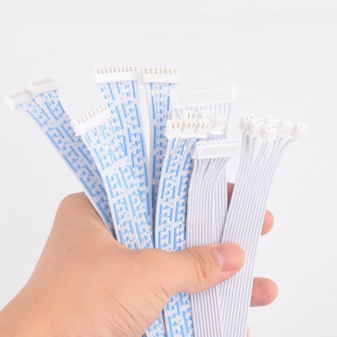 Hand holding Prototyping Jumper Wires Kit Featuring 2P To 6P Double Ended Male Connectors 10 20 Or 30 Cm PVC Cables 11 Strand Copper Core