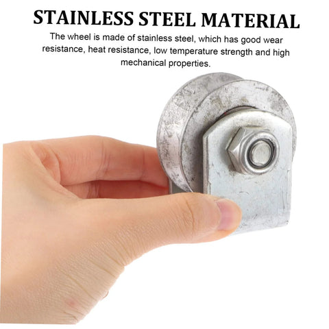 Cast-iron groove wheel garage-door roller with mounting bracket and bolt, held in hand