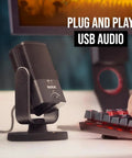 NT-USB Mini Condenser USB Microphone For Podcasting, Streaming, Gaming And Music Production next to keyboard in a setup
